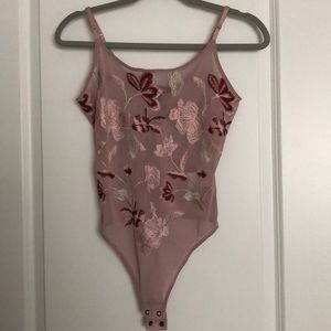 light pinkish flowery bodysuit
